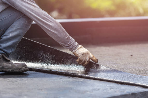 Professional Basement Waterproofing technician working in Lyons, KS